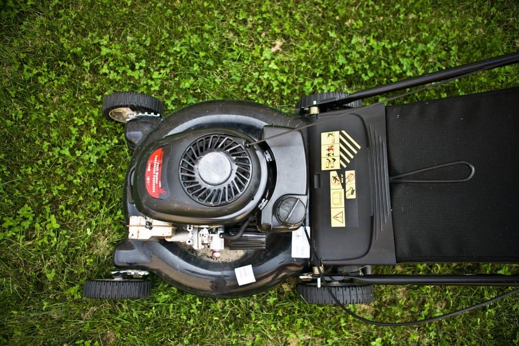 Lawn mower resting on a grass bed