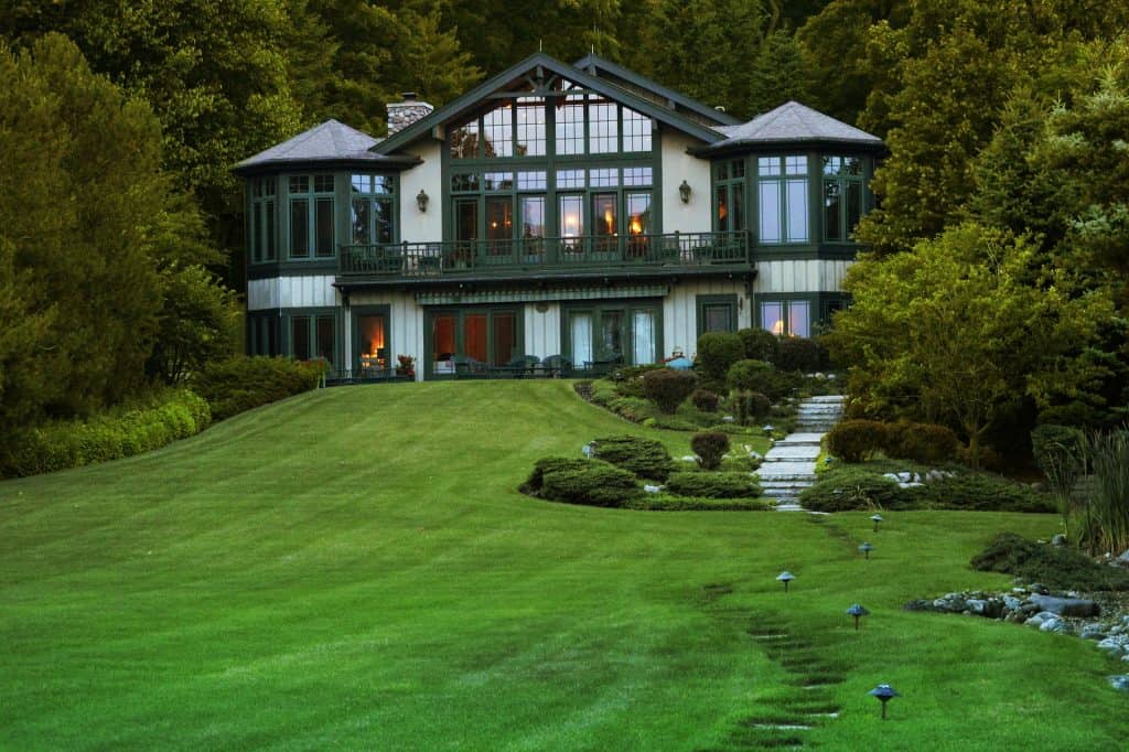 A house with a full and green lawn