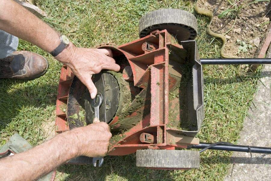 A man fixing the loose blade