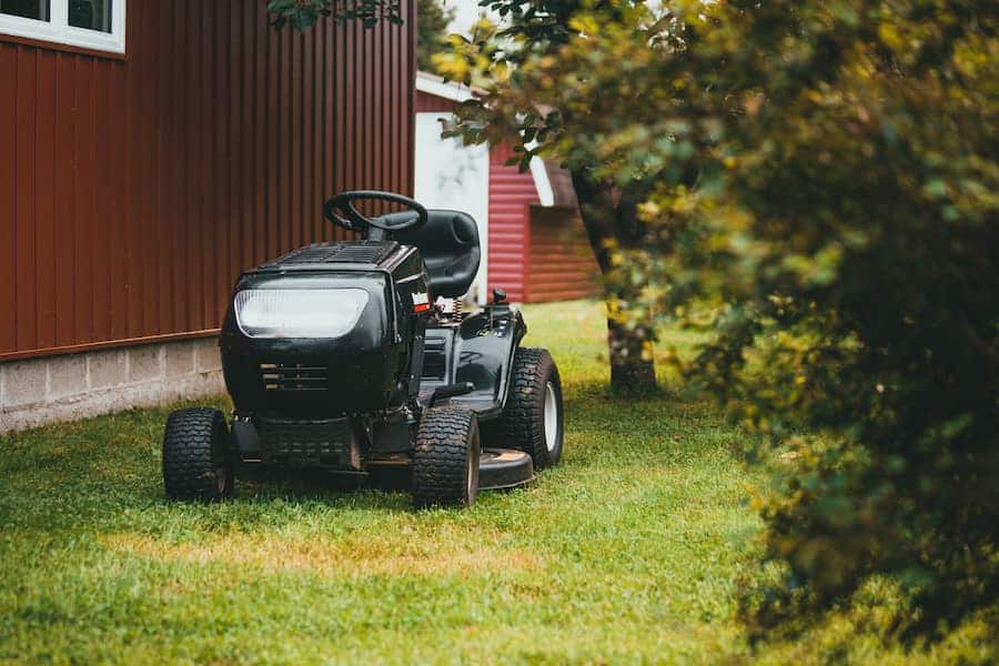 Preparing how to start a riding lawn mower with a screwdriver